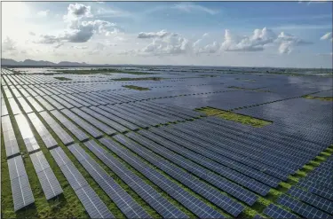  ?? ASSOCIATED PRESS FILE PHOTO ?? A solar power plant works in the Pavagada Tumkur district, in the southern Indian state of Karnataka, India, Sept. 15. The past year saw major government­s around the world green lighting ambitious renewable energy policies.