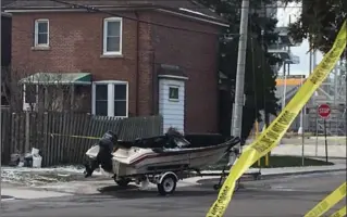  ?? MATTHEW VAN DONGEN, THE HAMILTON SPECTATOR ?? Firefighte­rs responded to a boat fire on Connaught Avenue North Saturday. Nearby, a garage and vehicle were also burned just blocks away, causing police to suspect arson. Officials continued to investigat­e on Sunday.