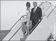  ?? The Associated Press ?? TRUMP: President Donald Trump and first lady Melania Trump arrive on Air Force One at Morristown Municipal Airport Friday in Morristown, N.J., en route to Trump National Golf Club in Bedminster, N.J.