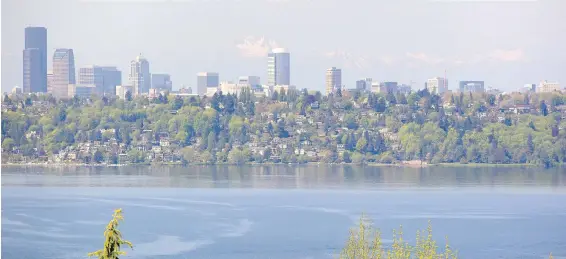  ??  ?? Downtown Seattle and Lake Washington sparkle from the top deck, which offers views of the Space Needle and city lights.