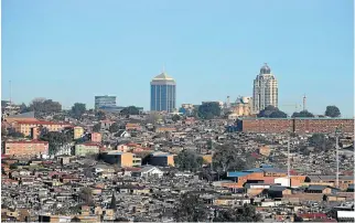  ?? /Reuters ?? Excluded: Townships such as Alexandra show cities reproduce dysfunctio­nal elements rooted in apartheid. Business areas are remote islands with grand edifices or places of decay.