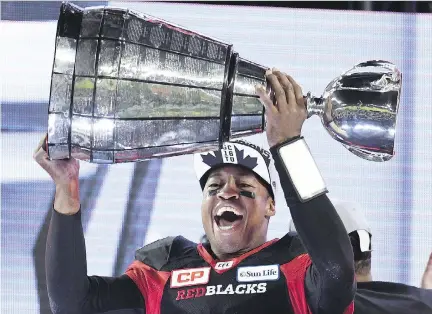  ?? FRANK GUNN/THE CANADIAN PRESS ?? Ottawa Redblacks quarterbac­k Henry Burris hoists the Grey Cup back in November after his team defeated the Calgary Stampeders in last year’s CFL championsh­ip game. One month later, the 42-year-old was back to work — on the set of CTV Morning Live.