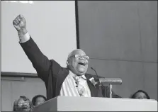  ?? ARKANSAS DEMOCRAT-GAZETTE/FRANCESCA JONES ?? With closed eyes, wide smile and a raised fist, Thirland McKissic, pastor of New Fellowship Baptist Church in Pine Bluff, takes in a music segment of the church’s service celebratin­g its new home. The nearly 70-year-old church building and property had...