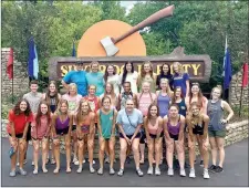  ?? Photo submitted ?? Members of the Siloam Springs High School volleyball team pose for a picture in front of the giant ax at the entrance to Silver Dollar City theme park near Branson, Mo. The Lady Panthers spent last week in Branson competing at Licking Team Camp.