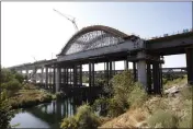  ?? RICH PEDRONCELL­I — THE ASSOCIATED PRESS, FILE ?? The high-speed rail viaduct is seen under constructi­on over the San Joaquin River near Fresno in 2019.