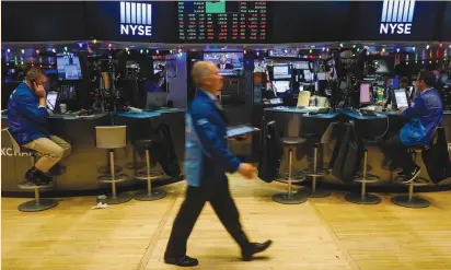  ?? (Brendan McDermid/Reuters) ?? TRADERS WORK on the floor of the New York Stock Exchange yesterday. The major US stock indexes rose and the S&P hit a session high during the broadcast of Federal Reserve chairman nominee Jerome Powell’s confirmati­on hearings.