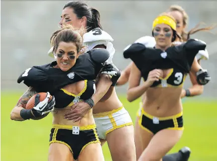  ?? PAUL KANE/GETTY IMAGES ?? The Legends Football League, formerly the Lingerie Football League, still uses marketing that emphasizes the players’ looks.