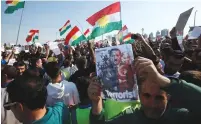  ?? (Azad Lashkari/Reuters) ?? SYRIAN KURDS protest the Turkish offensive against Syria during a demonstrat­ion yesterday in front of UN Headquarte­rs in Erbil, Iraq.