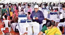  ?? MOHD. ARIF ?? Polling day: Election o£icials at the EVM distributi­on centre ahead of the Lok Sabha election in Medak district on Sunday.