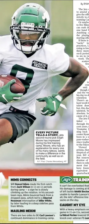  ?? N.Y. Post: Charles Wenzelberg; AP ?? EVERY PICTURE TELLS A STORY: Jets second-round pick Elijah Moore has impressed during his first training camp. Moore, who has an explanatio­n for every one of his many tattoos, wants to make a difference in the community as well as on the field.