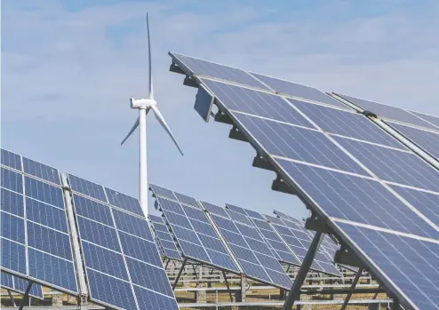  ?? HECTOR RETAMAL / AFP VIA GETTY IMAGES FILES ?? Solar panels and a wind generator are seen at an integrated power station in a coastal Chinese province north of Shanghai.
Investing in wind and solar proved something of a safe haven for world powers during the pandemic.