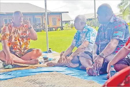  ?? Picture: SERAFINA SILAITOGA ?? The President Ratu Wiliame Katonivere chats with his men in Naduri Village.