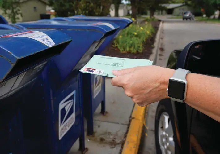  ??  ?? Mail balloting in the US presidenti­al election began Friday as North Carolina sent out more than 600,000 ballots to voters — responding to a massive spike in requests that has played out across the country as voters look for a safer way to cast ballots during the pandemic.