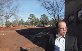  ?? JOE RONDONE/THE COMMERCIAL APPEAL ?? Paul Chandler, executive director of the Germantown Performing Arts Center, stands on the beginning stages of constructi­on for The Grove, GPAC'S outdoor performanc­e venue.