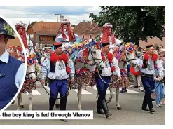  ?? ?? Colourful costumes as the boy king is led through Vlenov