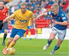  ??  ?? St Johnstone’s young midfielder Ali McCann (right).