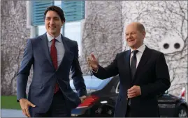  ?? The Canadian Press ?? Canadian Prime Minister Justin Trudeau is greeted by German Chancellor Olaf Scholz as he arrives at the Chanceller­y in Berlin, Germany in this file photo.