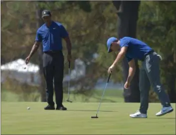  ?? PETE BANNAN — DIGITAL FIRST MEDIA ?? Tiger Woods, left, and Rory McIlroy are among those at Aronimink Golf Club this week for the BMW Championsh­ips.