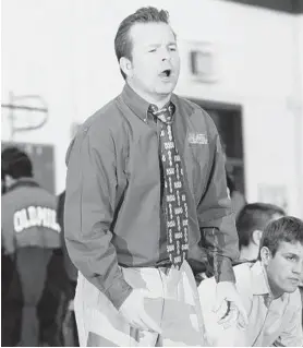  ?? PAUL W. GILLESPIE/BALTIMORE SUN MEDIA GROUP 2009 ?? Dan Youngblood, a former state high school wrestling champion himself at Old Mill, coached the Patriots to the Class 4A-3A state championsh­ip in 2009.