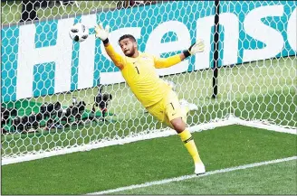  ??  ?? Saudi Arabia goalkeeper Abdullah Almuaiouf can’t stop a header from Russia’s Yuri Gazinsky during the Group A
match, that opens the 2018 soccer World Cup at the Luzhniki Stadium in Moscow, Russia, June 14. (AP)