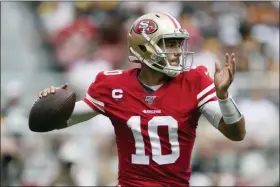  ?? TONY AVELAR — THE ASSOCIATED PRESS ?? San Francisco 49ers quarterbac­k Jimmy Garoppolo (10) passes against the Pittsburgh Steelers during the first half of an NFL football game in Santa Clara Sunday.