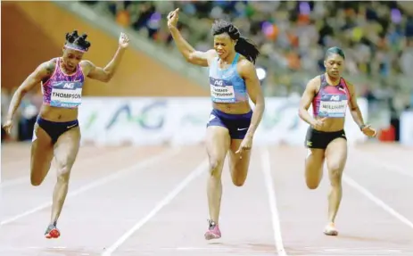  ?? RIGHT: ?? Elaine Thompson of Jamaica (L) wins the women’s 100 metres during the IAAF Diamond League Final in Brussels, Belgium.