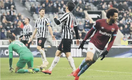  ??  ?? West Ham United’s Felipe Anderson (right) celebrates scoring his side’s third goal of the game.