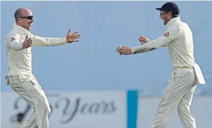  ?? Picture: AP. ?? “Caught Buttler, bowled Leach”: Jack Leach, left, and Jos Buttler celebrate the dismissal of Sri Lanka’s Dilruwan Perera.