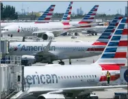  ?? WILFREDO LEE, FILE - THE ASSOCIATED PRESS ?? In this April 24 photo, American Airlines aircraft are shown parked at their gates at Miami Internatio­nal Airport in Miami. A bail hearing is scheduled for a mechanic charged with sabotaging an American Airlines jetliner as part of a labor dispute. Prosecutor­s are seeking pretrial detention for 60-year-old Abdul-Majeed Marouf Ahmed Alani at a hearing Wednesday, Sept. 18.