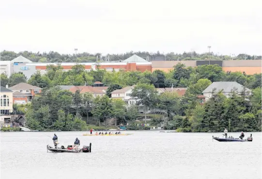  ?? ERIC WYNNE • THE CHRONICLE HERALD ?? Lake Mic Mac in Dartmouth was busy Sunday morning with fishers taking to the water, and the land, to hopefully land a big one.