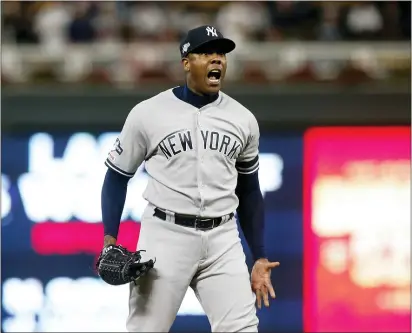  ?? JIM MONE — THE ASSOCIATED PRESS ?? Yankees relief pitcher Aroldis Chapman celebrates after his team’s 5-1victory over the Twins in Game 3of an ALDS in Minneapoli­s.