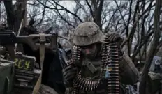  ?? Sergey Shestak/AFP via Getty Images ?? A soldier from the Ukrainian Volunteer Army prepares ammunition to fire at Russian front-line positions Sunday near Bakhmut.