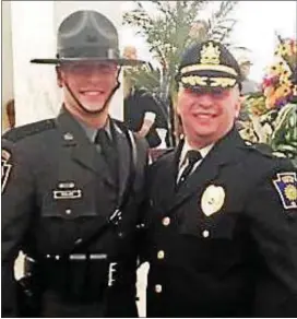  ??  ?? Pennsylvan­ia State Police Trooper James Nolan V and his Chester Police Chief James Nolan IV father,