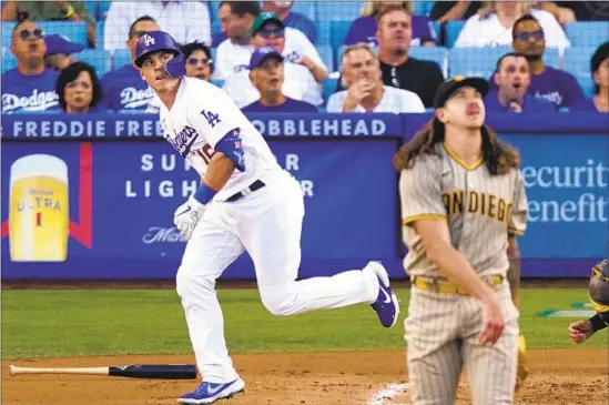  ?? Mark J. Terrill Associated Press ?? WILL SMITH starts his trot around the basepaths following his solo home run off Padres’ starter Mike Clevinger in the second inning at Dodger Stadium.