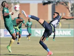  ??  ?? Gerald Phiri of Platinum Stars (right) clears the ball from Kudakwashe Mahachi of Golden Arrows during their Nedbank Cup clash at the Princess Magogo Stadium in Kwa-mashu yesterday.