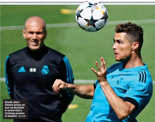  ?? REUTERS ?? Heady days: Zidane keeps an eye on Ronaldo in yesterday’s training session in Madrid