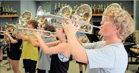  ?? Jeremy Stewart ?? The Rockmart High School marching band has been working both on the practice field and in the band room to perfect its 2021 halftime show through the summer to bring it to fans on Friday nights.