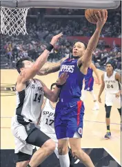  ?? MARK J. TERRILL — THE ASSOCIATED PRESS ?? The Clippers’ Amir Coffey, right, drives to the basket as the Spurs’ Drew Eubanks defends during Tuesday’s game.