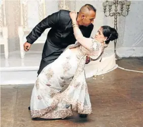  ??  ?? DANCE WITH ME TONIGHT: Mr and Mrs Singh burn up the floor for their first dance as husband and wife