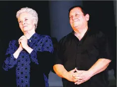  ??  ?? Actors Burt Ward, who was Robin, and Lee Meriwether — who played Catwoman in the 1966 ‘Batman’ movie — watch before a bat-signal is projected on City Hall in honour of late actor West in Los Angeles, California, on Thursday. — Reuters photo