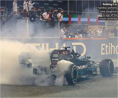  ?? PICTURE: GETTY ?? Rubbing it in: Hamilton performs some doughnuts to sign off the season yesterday