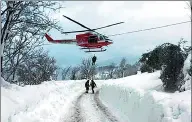  ?? VIGILI DEL FUOCO / REUTERS ?? Rescuers arrive near Hotel Rigopiano hit by an avalanche in Farindola, central Italy, on Thursday.