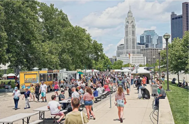  ?? ?? Thousands of attendees flock Downtown for the Columbus Arts Festival, which featured more than 200 artists and food and drink vendors along the Scioto Mile.