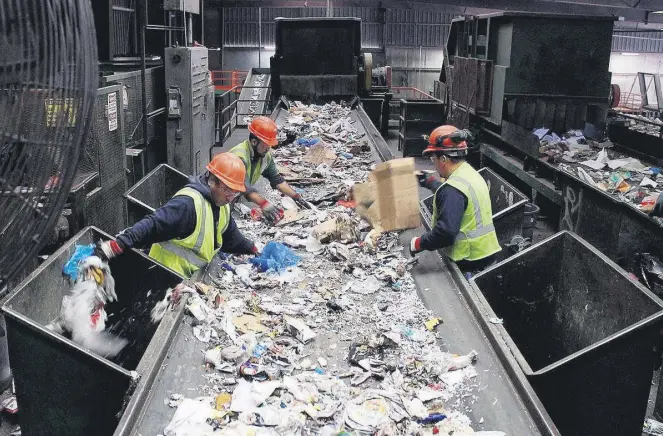  ??  ?? Workers sort recyclable waste at a facility. Turkey started a zero waste project last year to alleviate landfill use and boost recycling.