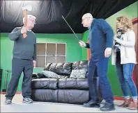  ?? SUBMITTED PHOTO/MIRA PLAYERS ?? During a rehearsal for the Mira Players upcoming comedy-mystery production, “Borderline Crazies,” Bob Lewandowsk­i as Ira threatens Harvey Pyke as Stu with a fearsome axe as Barbara Beaton as Elle looks on apprehensi­vely.