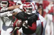  ?? (NWA Democrat-Gazette/Charlie Kaijo) ?? Arkansas quarterbac­ks Malik Hornsby (above) and KJ Jefferson have both impressed Rice Coach Mike Bloomgren, whose Owls take on the Razorbacks on Saturday in Fayettevil­le.