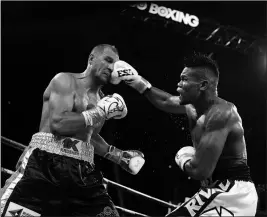  ?? ASSOCIATED PRESS ?? ELEIDER ALVAREZ, of Colombia, connects a punch to Sergey Kovalev, of Russia, during the seventh round of their 175-pound boxing bout Saturday in Atlantic City, N.J. alvarez won by knockout in the seventh round.