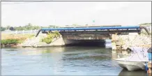  ?? John Moritz / Hearst Connecticu­t Media ?? Water races under a bridge in Old Saybrook. Residents in Great Hammock Beach say the bridge is causing erosion.