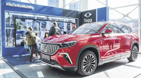  ?? ?? The T10X fully electric SUV model, produced by Turkish car manufactur­er Togg is exhibited at the fair in the capital of Ankara, Türkiye, Feb. 10, 2024.