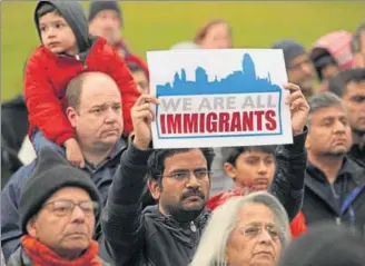  ?? REUTERS FILE ?? People at a vigil in honour of Srinivas Kuchibhotl­a, an Indian engineer killed in Kansas in a possible hate crime.